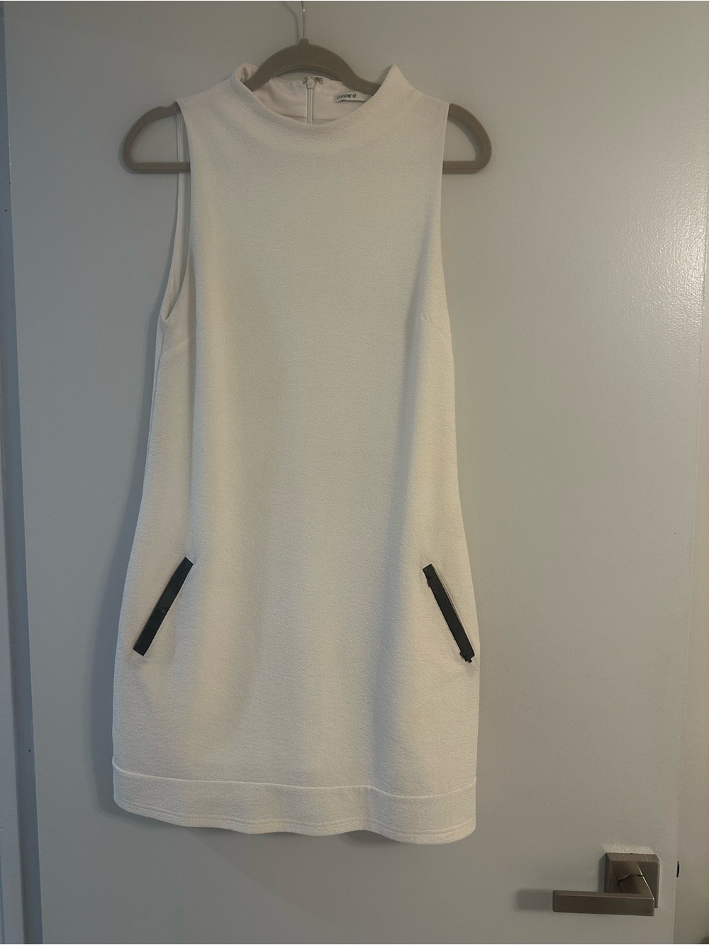 Minimalist Cream Sleeveless Mini Dress with Black Zip Details